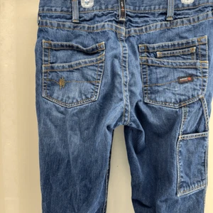 Pantalones de mezclilla Ariat M4 FR Cat 2 para hombre 36x36 relajados corte bota azul usados en excelente estado - Imagen 1 de 11