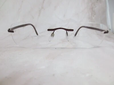 Marco de gafas Silhouette 7548-40-6060 para mujer marrón metal sin montura 18-140 Foto 1 de 4