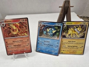 Pokémon TCG: Prismatic Evolutions - Eevee Poster Promo Cards SVP 167, 168 & 169 - Picture 1 of 9