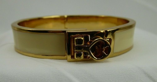 Bracciale Kate Spade New York Hole Punch Spade tono oro e smalto avorio