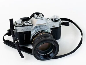 Canon AE-1 Program Reflex 35mm + Obiettivo Canon FD 50mm f/1.4 – Perfetti - Bild 1 von 11