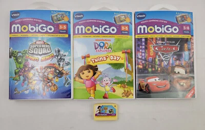 Lof Of 4 MobiGo VTech Games Superhero Squad Dora Twins Day Cars 2 Toy Story 3 - Image 1 of 4