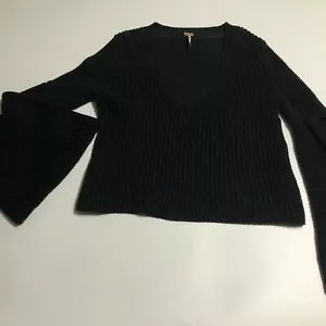 Suéter suéter Free People de gran tamaño tejido con cable cuello en V XS negro dobladillos de brazo ancho - Imagen 1 de 5