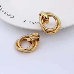 Clip on 1 1/2" gold textured loose knot button style earrings - Picture 1 of 2