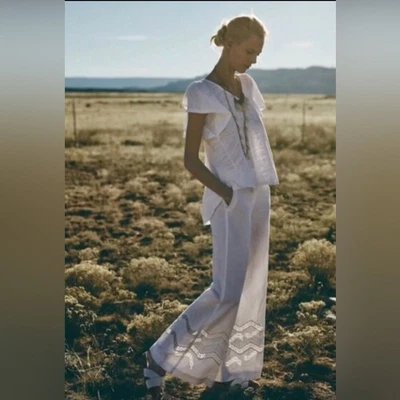 PANTALONES PANTALÓN ANTHROPOLOGIE CALADOS PIERNAS ANCHAS BLANCO de ELEVENSES 10 Foto 1 de 4