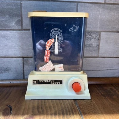 DE COLECCIÓN 1976 TOMY WATERFUL ROBOT ANILLO LANZAMIENTO AGUA PORTÁTIL JUEGO JUGUETE Foto 1 de 4