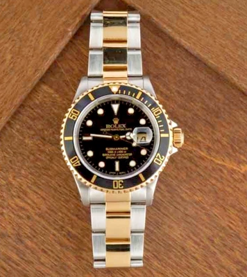 Rolex Submariner 40 mm 16613 oro amarillo de 18 quilates y acero esfera negra automático Foto 1 de 4
