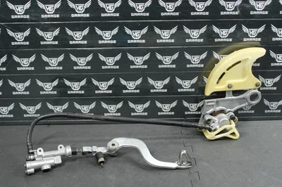 Honda CR125R 2005 05-07 OEM PINZA DE FRENO TRASERA CILINDRO MAESTRO MANGUERA DE PEDAL Foto 1 de 4