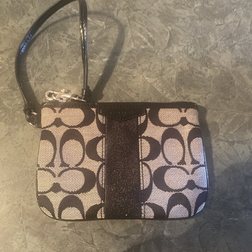 Borsa piccola Coach Monogram con zip angolare da polso