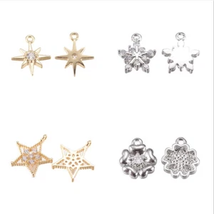 Dijes de latón micro pavé de circonita cúbica con forma de estrella/flor para hacer collares - Imagen 1 de 13