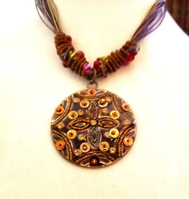 SALE!  Vintage gold and copper medallion on brown/green cord, pendant choker - Image 1 of 4