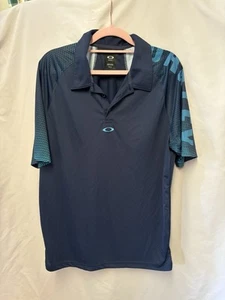 OAKLEY Golf Polo Shirt Mens L Blue Spellout Stretch Performance Embroidered - Picture 1 of 2
