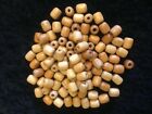 100 wooden beads 1.5 cms x 1 cms each bead
