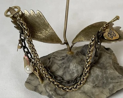 Vtg Betsey Johnson 2 Strand Brass Bracelet Mixed Charms Heart Logo Toggle Clasp - Image 1 of 4