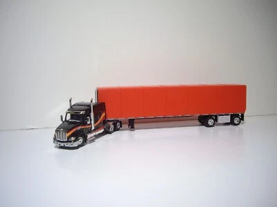 DCP FIRST GEAR 1/64 BLACK PETE 579 WITH SLEEPER AND SIMULATED ROLL TARP TRAILER - Image 1 of 4