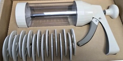 The Pampered Chef Cookie Press # 1525  Set Of 16 Molds - Image 1 of 3