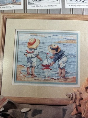 BY THE SEA CHILDREN AT PLAY CROSS STITCH  PATTERN BOYS WITH BOATS - Image 1 of 3