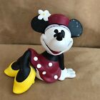 Minnie Mouse Ceramic Piggy Bank by Enesco reclining kicking back