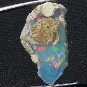 7,15 ct AAA Natürlicher Äthiopischer Opal Grob Welo Feueropal Grob 14x24x5 mm SR174 - Bild 1 von 7