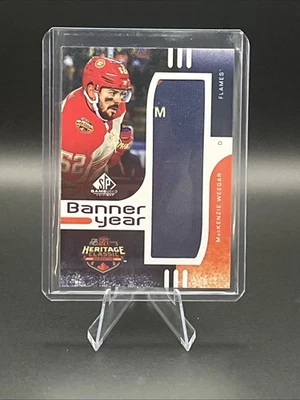 2024-25 UD SPGU MacKenzie Weegar Banner Year Patch (M On Patch) Calgary Flames - Image 1 of 2