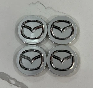 (4 X) MAZDA 56mm Silver Wheel Center Caps Mazda 3/5/6, RX 8, Miata, CX-3/5/7/9 - Picture 1 of 3
