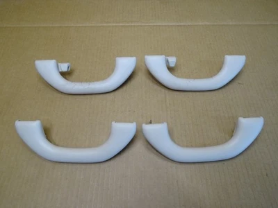 Juego de manijas de agarre interior para techo Volkswagen Tiguan 2009-2017 4 piezas color tostado OEM Foto 1 de 4