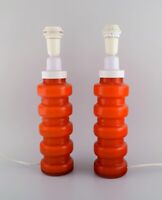 PO Ström for Alsterfors. Two table lamps in orange mouth blown art glass.