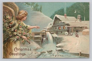 Postal antigua en relieve de ángel de saludos de Navidad escena de invierno antiguo molino - Imagen 1 de 2