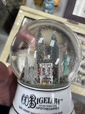C.O. Bigelow Apothecaries New York Porcelain/Glass Musical Snow Globe Working! 