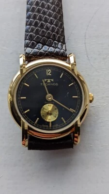 VINTAGE TECHNOS SWISS MADE QUARTZ STAINLESS STEEL SHATTERPROOF WATCH  - Image 1 of 4