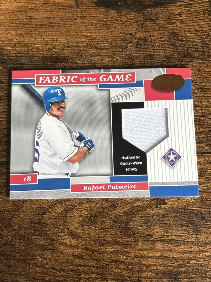 2002 Leaf Certified - Fabric of the Game Rafael Palmeiro #FG137 Bronze /100 MEM - Image 1 of 2