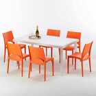 Rechthoekige salontafel wit 90x90 cm met stalen onderstel en 4 gekleurde stoelen