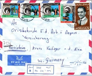 JORDAN 1976 POSTAL REG CORREO AÉREO CUBIERTA MUL FRANQUEADO ADDR ALEMANIA MATASELLOS IRBID - Imagen 1 de 2