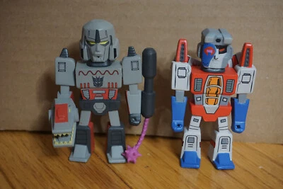 Kidrobot Transformers Vs. G.I. Joe 3" Vinyl Mini Figure Starscream & Megatron - Image 1 of 4