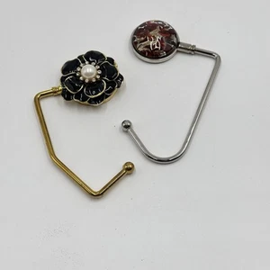 Juego de 2 Ganchos Porta Cartera Bolso de Mano Broche Negro y Rojo Dorado Plata Abstracto - Imagen 1 de 14