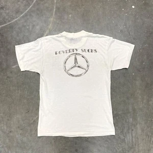 Camiseta de colección años 70 Mercedes Benz Poverty Sucks Jerry Mesmer papel caja de juguetes delgada - Imagen 1 de 6