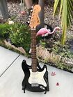 1990's/2000's Squier Strat Black W/White Pickguard Indonesian Made.
