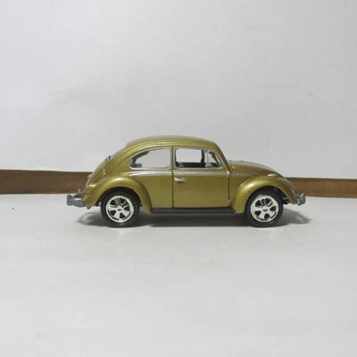 ANTIGUO DIECAST JOHNNY LIGHTNING 1966 VOLKSWAGEN BEETLE EN DORADO Foto 1 de 4