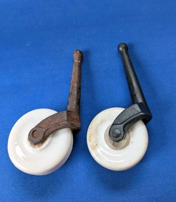 Lot of 2 Vintage White Porcelain and Cast Iron Furniture Casters 1 3/4" Diameter - Image 1 of 4