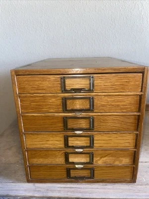 Antique Wooden Cabinet Features Multiple Small Drawers With Metal Label Holders - Image 1 of 4