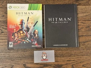 Hitman HD Trilogy (Xbox 360) Juego de 2 discos completo con manual, libro de arte y funda - Imagen 1 de 4
