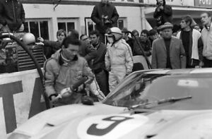 Pedro Rodriguez waits beside his Ford GT40 Le Mans 1968 Old Motor Racing Photo