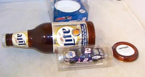 1:64 ACTION 2002 #2 MILLER LITE FORD TAURUS IN REPLICA BEER BOTTLE RUSTY WALLACE - Picture 1 of 8