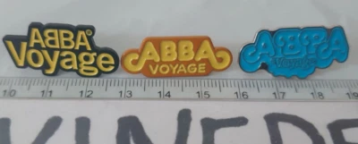 Abba Voyage 3 Pin Badge Set Musical Theatre Blue Yellow Black - Image 1 of 2