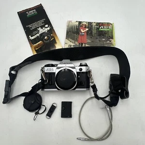 CANON AE-1 PROGRAM CAMERA BODY ONLY + BATTERY, MANUAL, SHUTTER CABLE - TESTED - Picture 1 of 20
