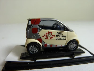 Busch Smart 48945 1/87 MB City Coupe Zoll Schweiz CH Schweizer Zoll PKW HO NUOVO - Immagine 1 di 4