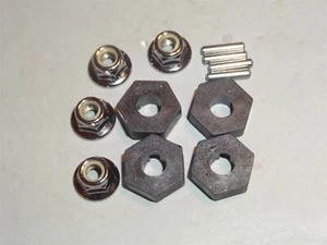 TRAXXAS T-MAXX 3.3 BUJES HEXAGONALES TUERCAS DE RUEDA PASADORES - Imagen 1 de 3
