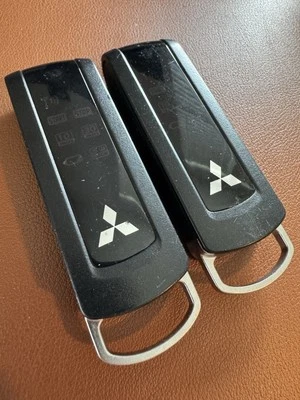 Lot Of 2 - 2008-14 MITSUBISHI OUTLANDER SPORT KEYLESS  REMOTE START OEM - USED - Image 1 of 4