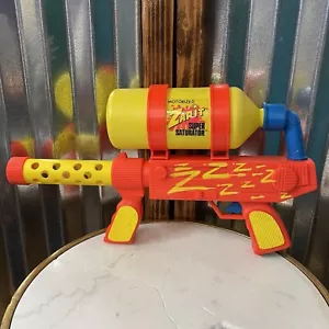 Vintage 1991 ~ ZAP IT ~ AUTOMATISCHER MOTORISIERTER SUPERSÄTTIGER Wasserspritzer Spielzeug - Bild 1 von 15