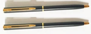 COPPIA PENNE A SFERA WATERMAN NERE RIFINITURE COLORE ORO ( 2 PENNE ) - Picture 1 of 4